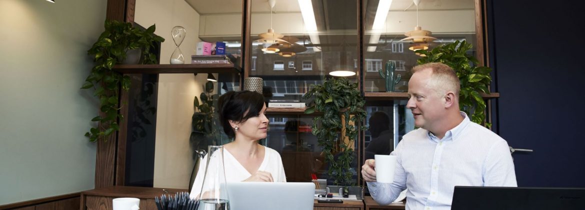 Man and Woman In Office Meeting